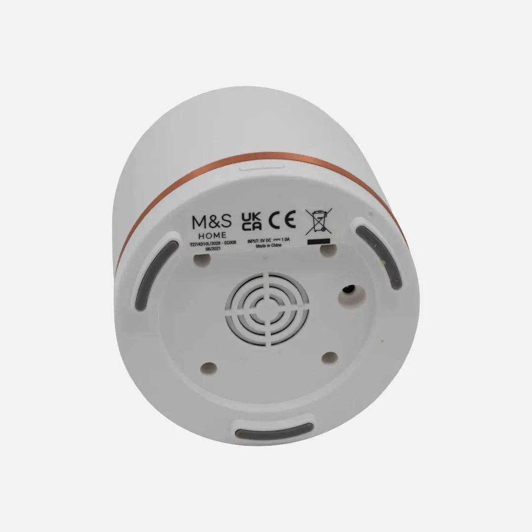Underside view of the M&S Home ultrasonic diffuser showing label and base design.